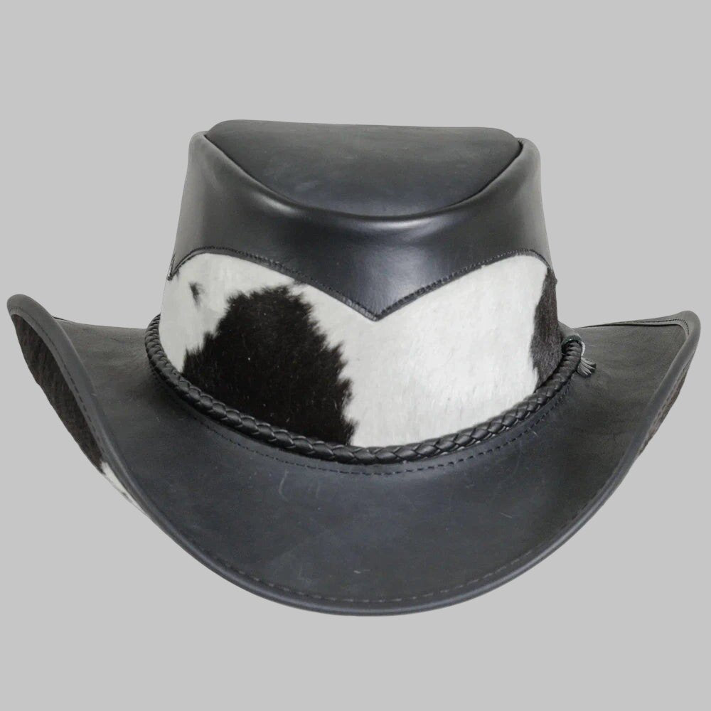 Black leather hat with cowhide trim on a gray background