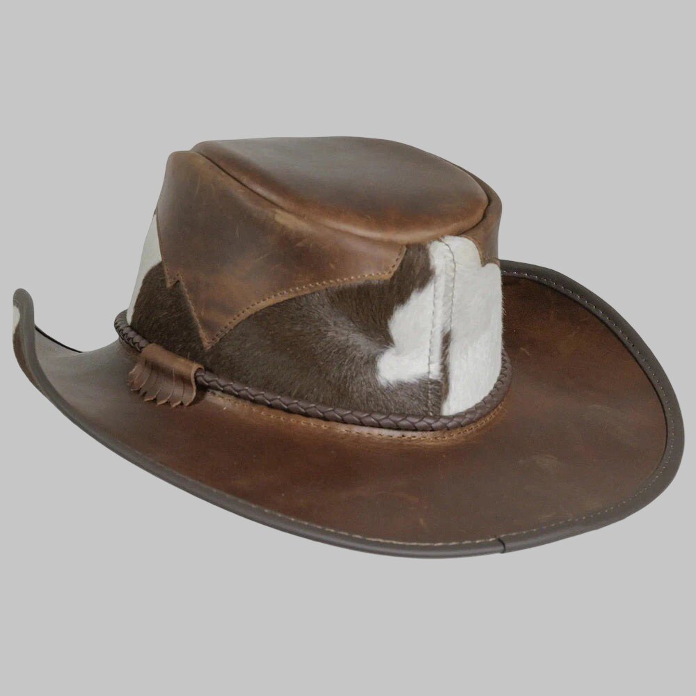 Brown leather hat with fur lining on a gray background